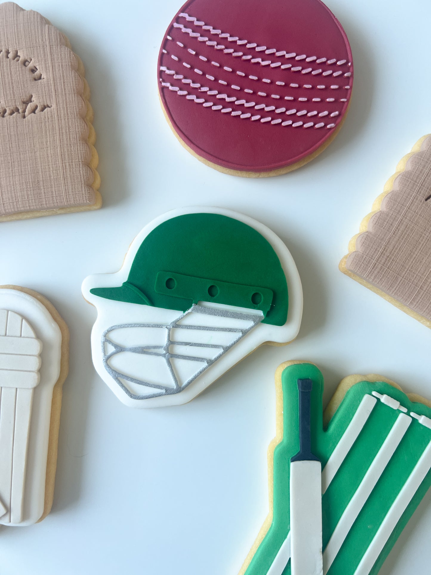 Cricket helmet debosser and cutter