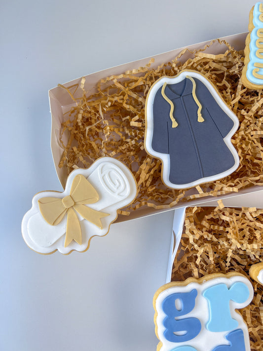 Graduation scroll debosser and cutter